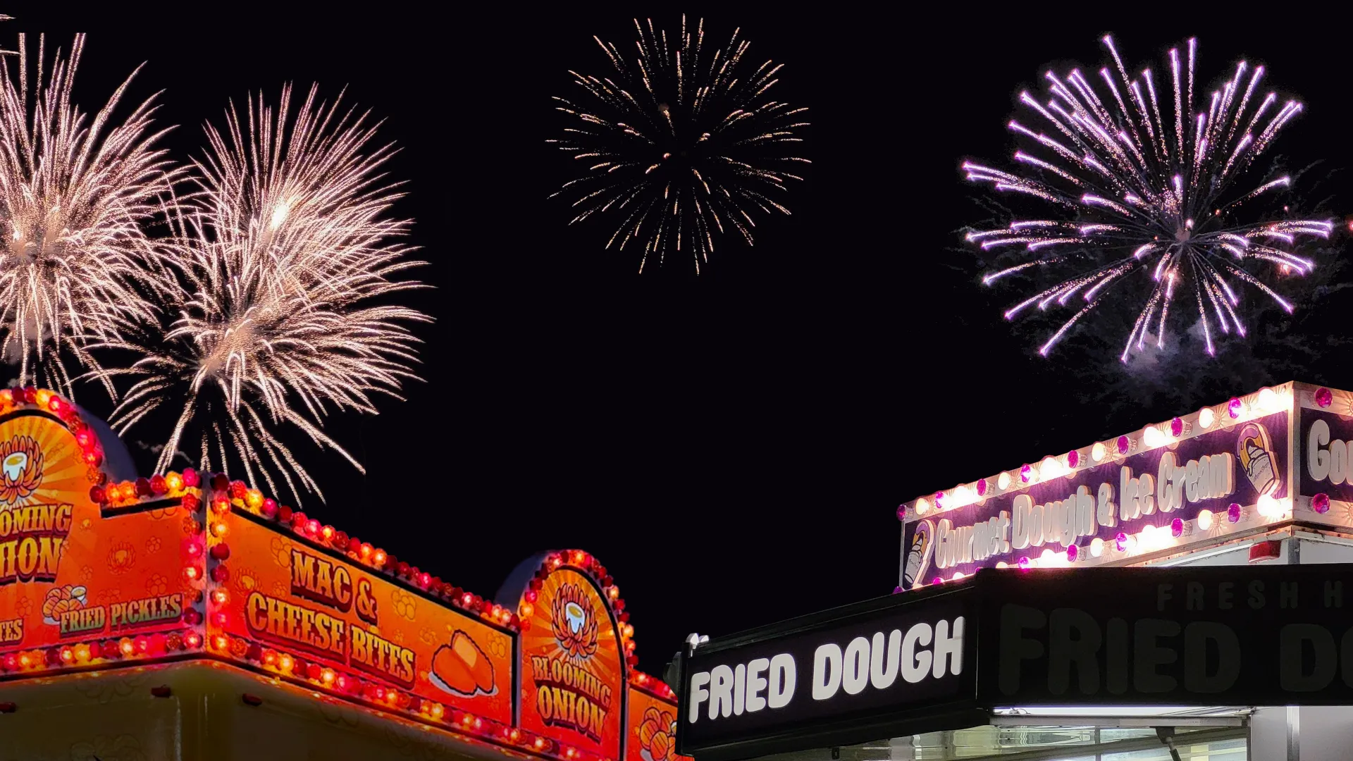 Fahie Amusements and Fairfoods at night, with fireworks